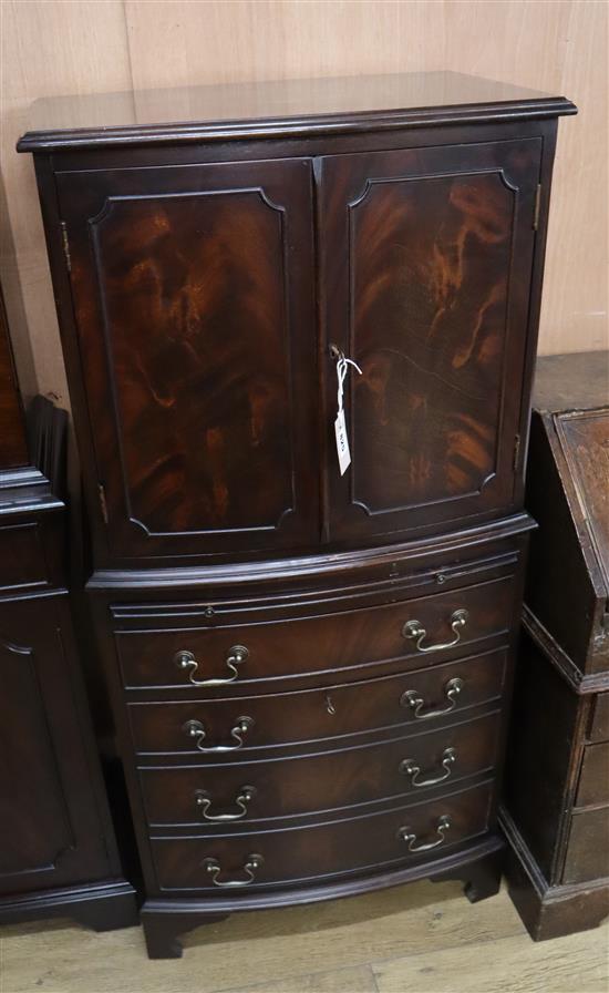 A reproduction mahogany bowfront cabinet W.61cm